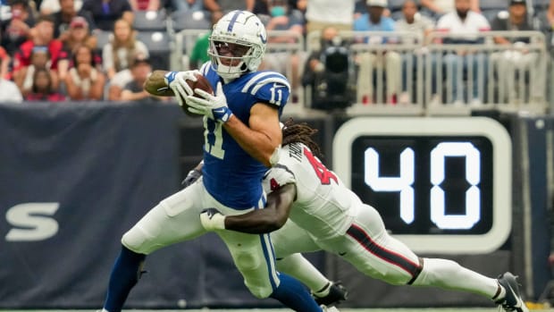 Houston Texans cornerback Tavierre Thomas (4) works to bring down Indianapolis Colts wide receiver Michael Pittman Jr. (11) on Sunday, Sept. 17, 2023, during a game against the Houston Texans at NRG Stadium in Houston